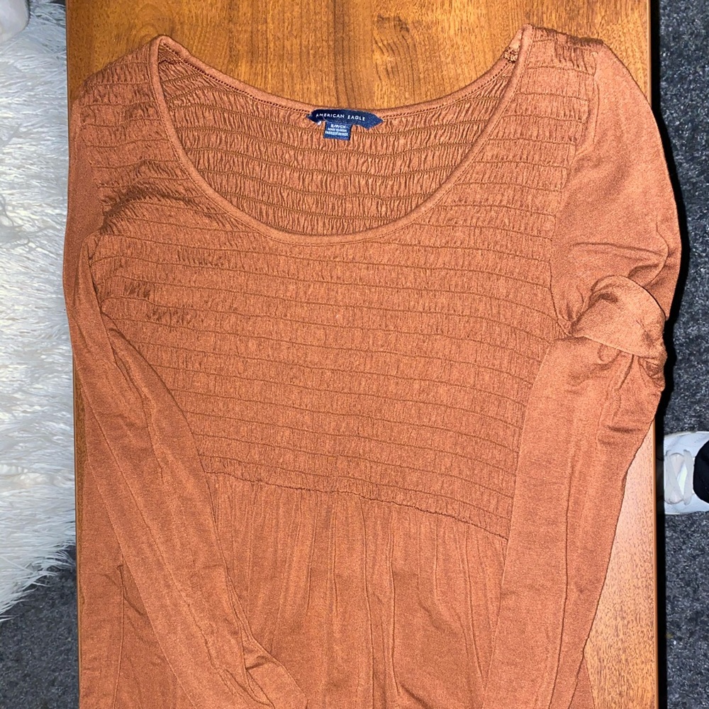 Orange ruched long sleeve top